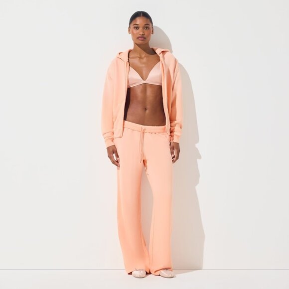 Skims French Terry Zip Up Hoodie in Cantaloupe, Size Medium - Picture 2 of 11